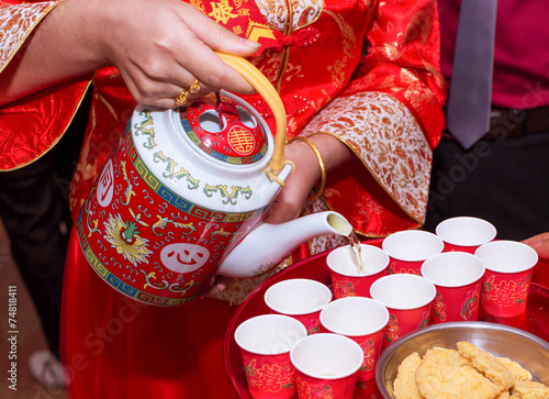 the bride serving the tea for the elders