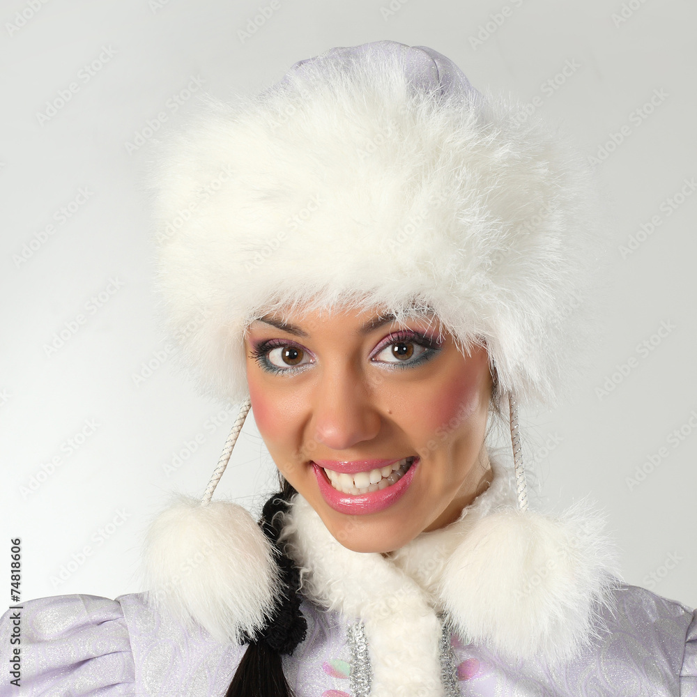 Emotional and cheerful Santa Girl in white and blue outfit. Emotional and cheerful Santa Girl in white and blue outfit.