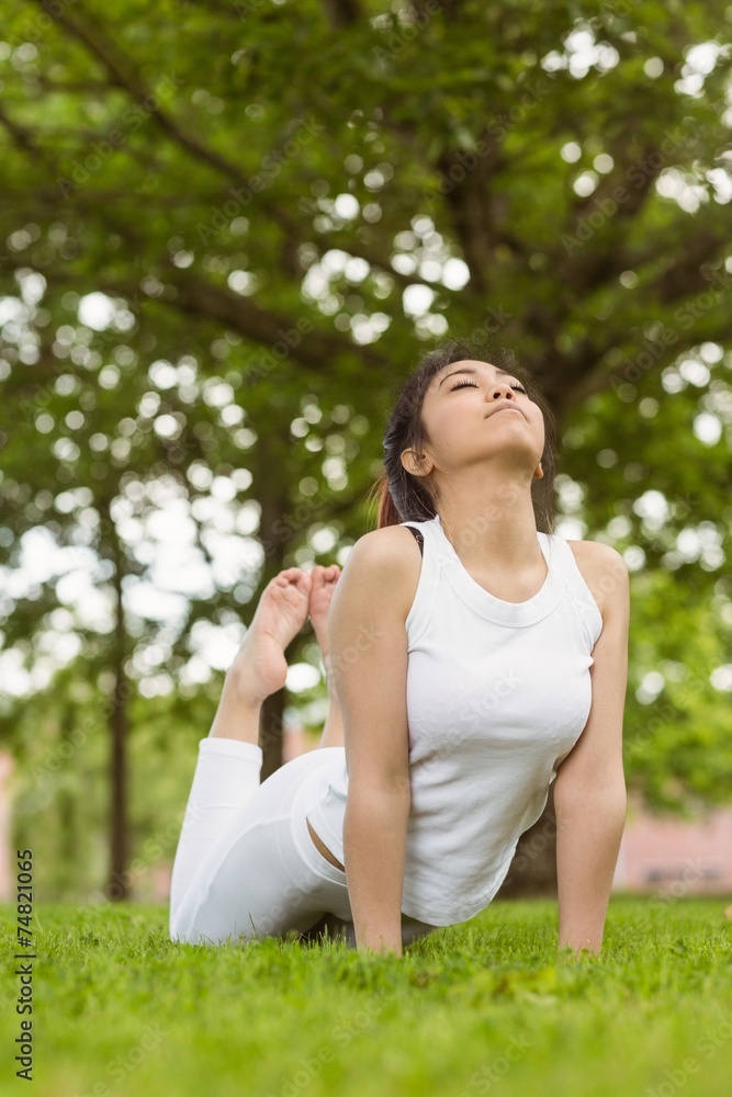 Healthy woman doing stretching exercises at park Healthy woman doing stretching exercises at park