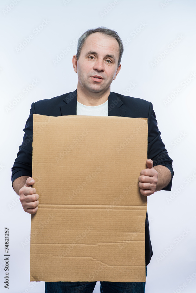 Businessman showing the big blank card in hand Businessman showing the big blank card in hand