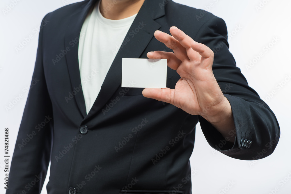Businessman showing the blank card in hand Businessman showing the blank card in hand