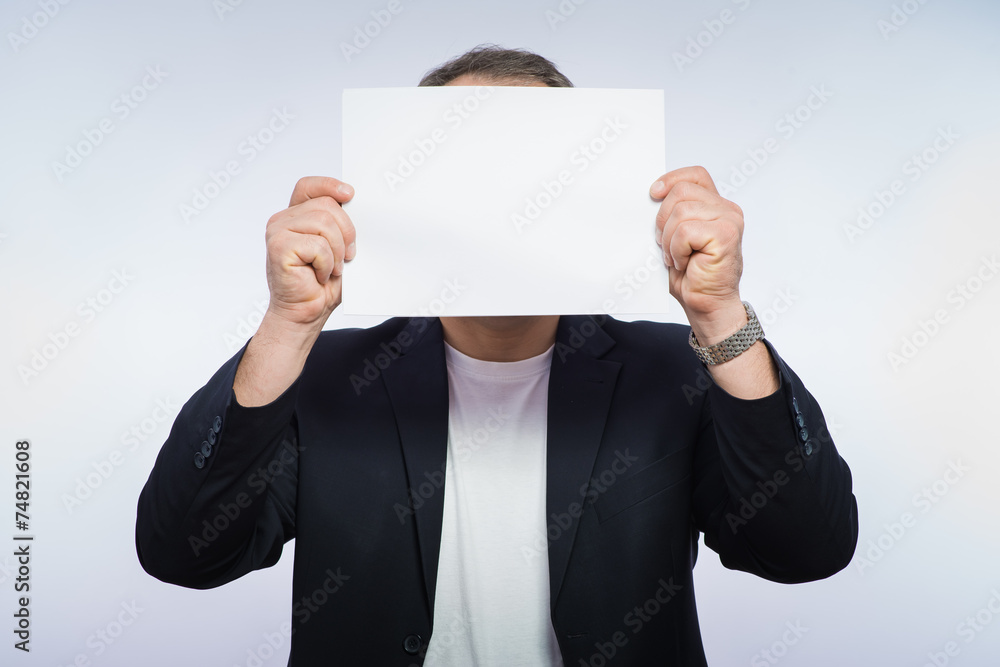 Businessman showing the big blank card in hand Businessman showing the big blank card in hand