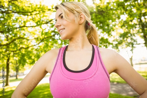 Fit blonde standing in the park