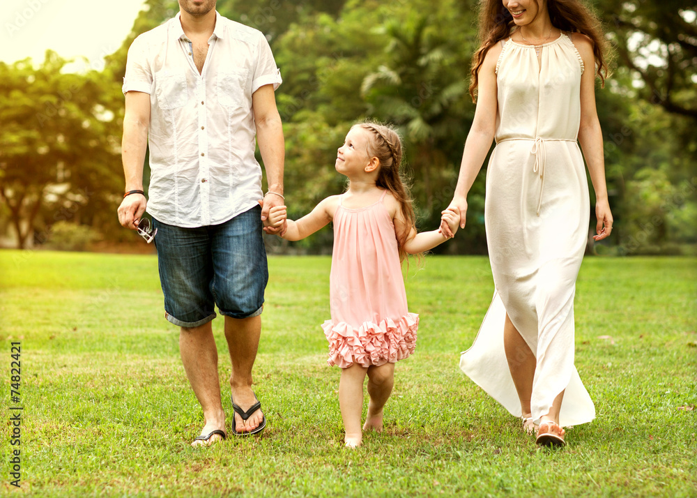 Obraz premium Family walk in the park, happy at sunset in Bangkok, Thailand.