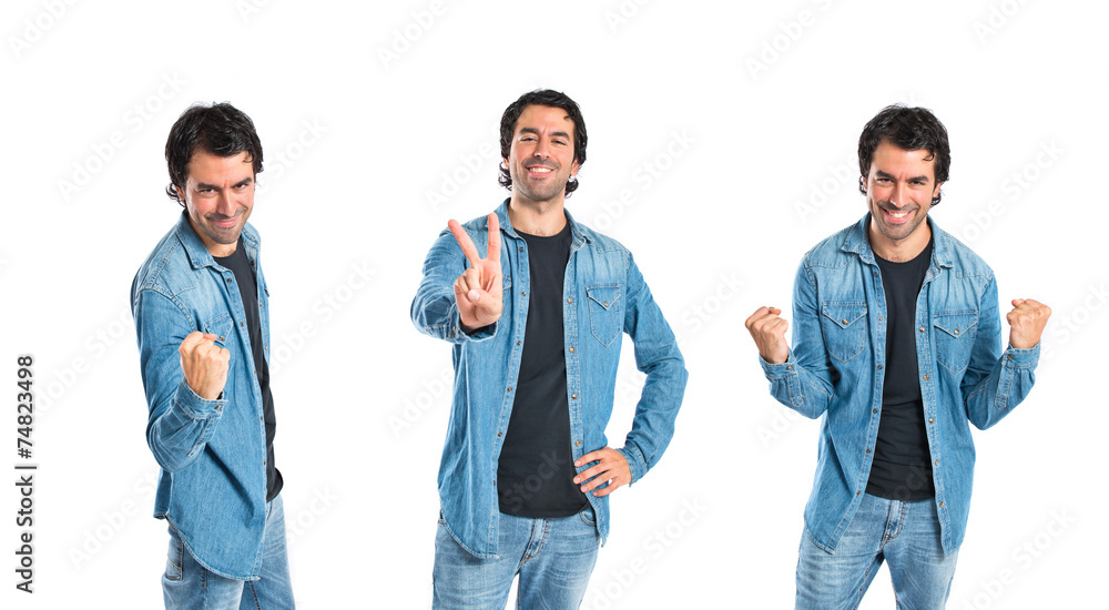 Lucky young man over isolated white background Lucky young man over isolated white background