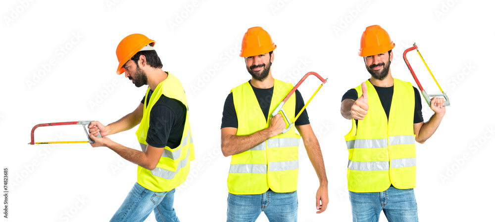 Workman with hacksaw over white background