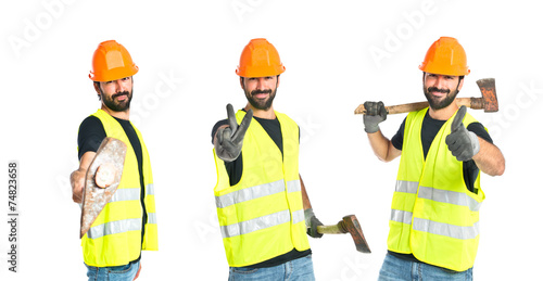 Workman with ax over white background © luismolinero