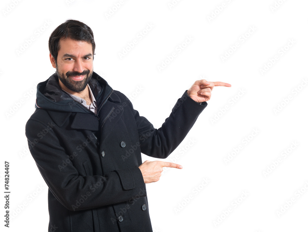 Man pointing to the lateral Man pointing to the lateral