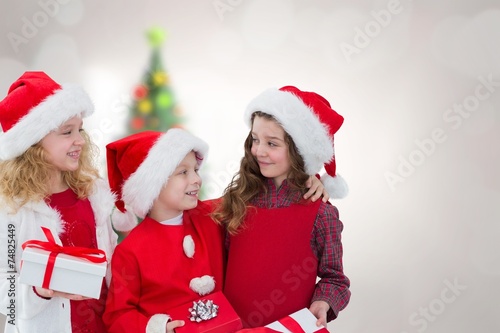 Composite image of cute children with gifts