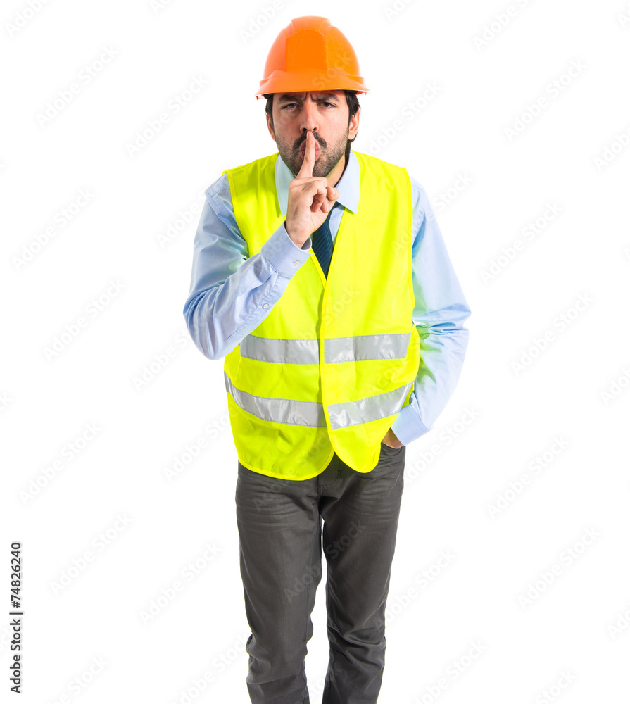 Worker making silence gesture Worker making silence gesture