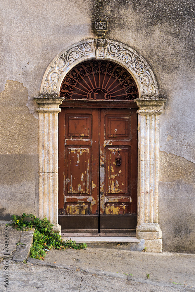 wood door on a street in Sicily