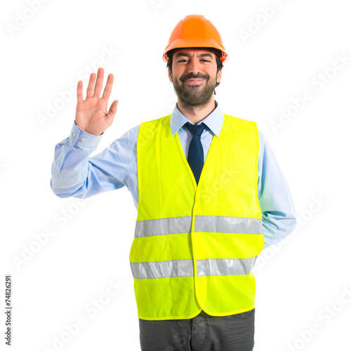 Worker saluting over white background