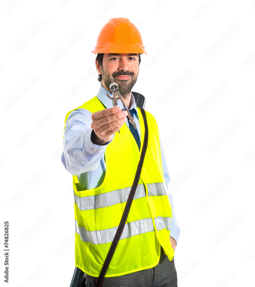 architect holding a compas architect holding a compas