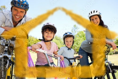 Composite image of family with their bikes © WavebreakmediaMicro