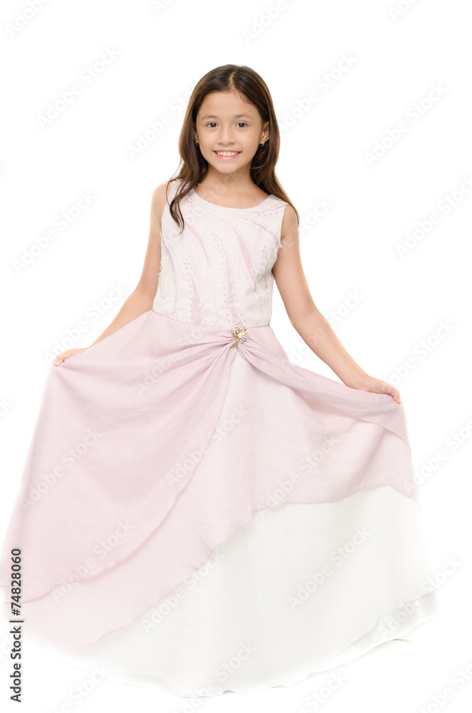 Little girl portrait on pink dress smiling on white background
