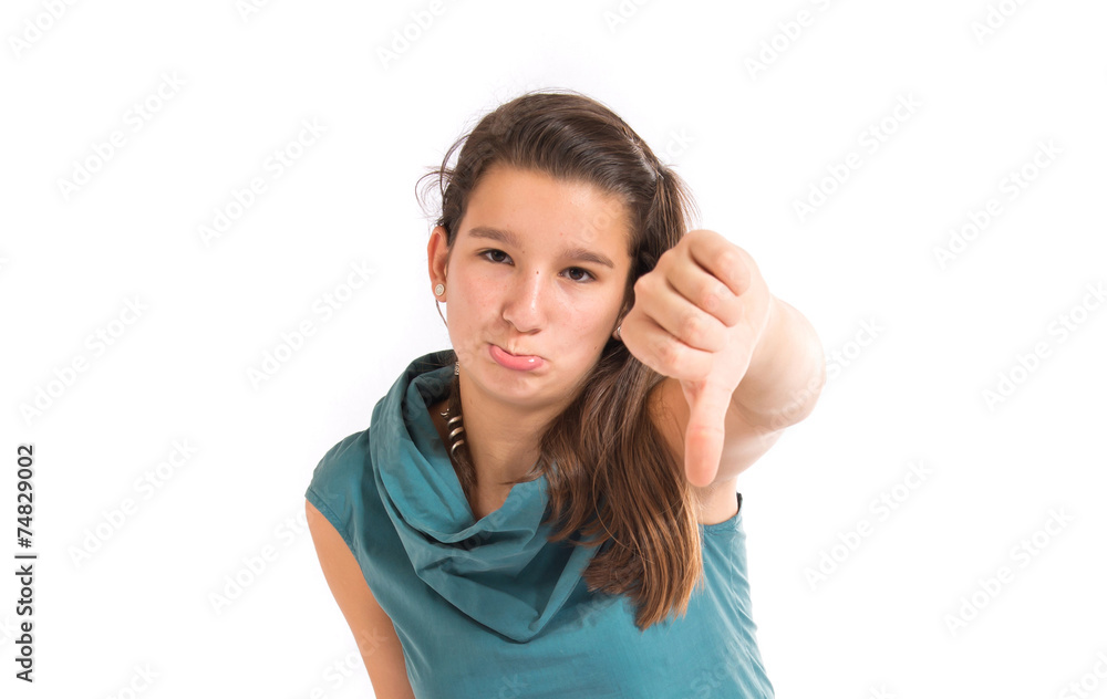 Girl doing a bad signal over white background Girl doing a bad signal over white background
