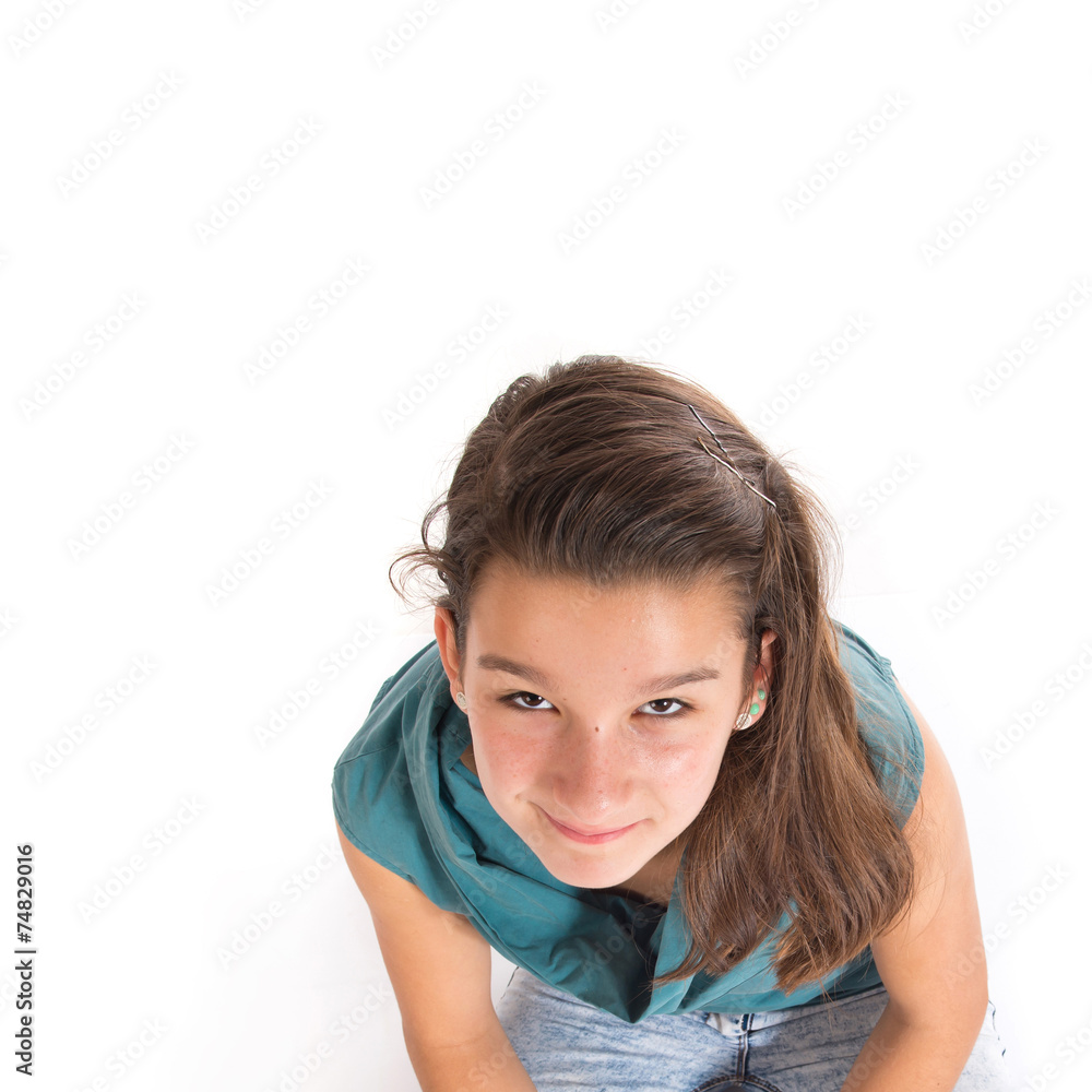 Girl sitting in the floor over white background Girl sitting in the floor over white background