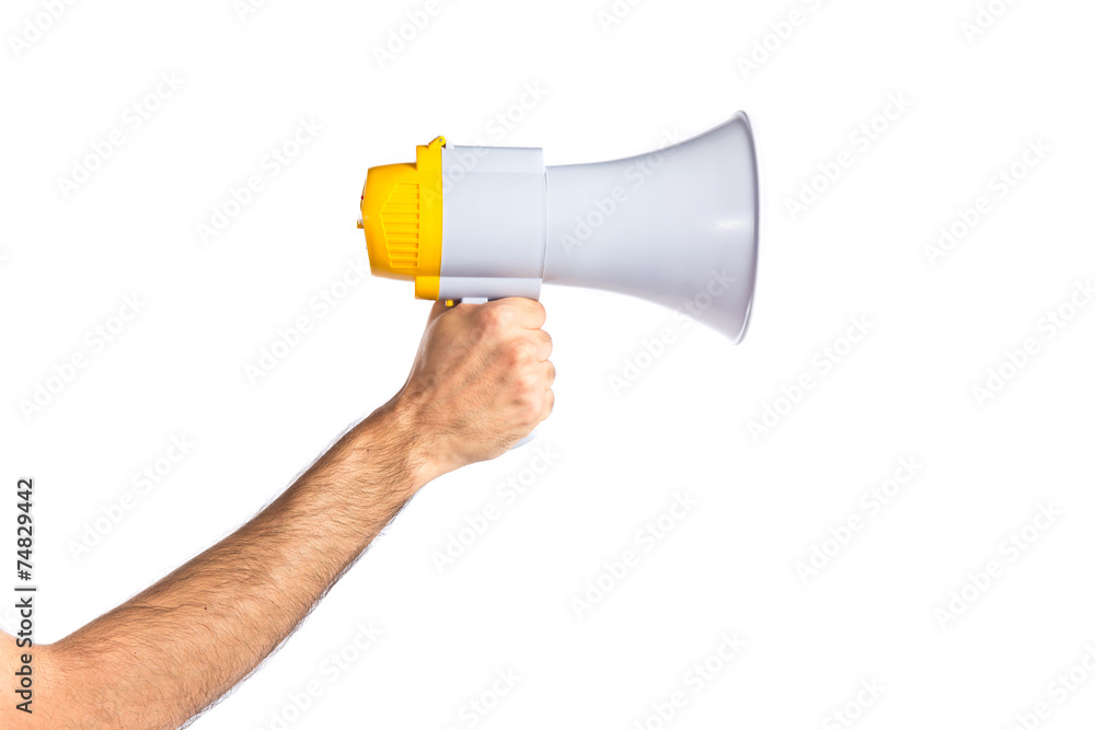 hand holding a megaphone over white background hand holding a megaphone over white background