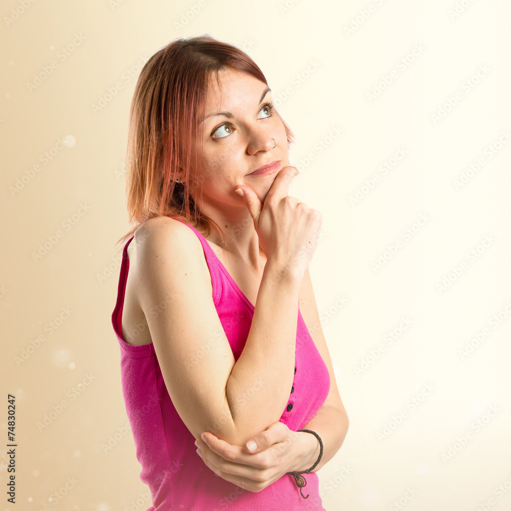 Young girl thinking over white background Young girl thinking over white background