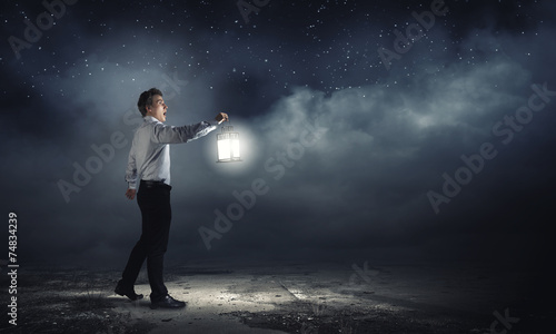 Man with lantern © Sergey Nivens