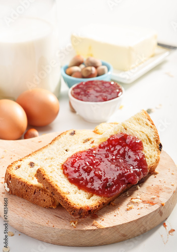 Healthy breakfast. Two slices of bread with jam on wooden table.
