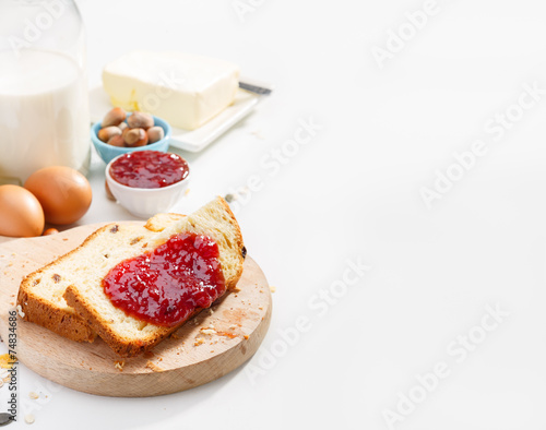 Healthy breakfast. Two slices of bread with jam on wooden table.