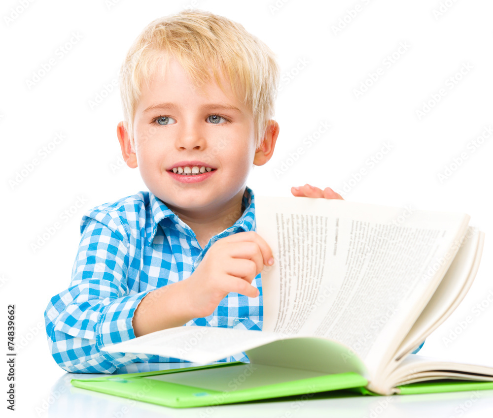 Little child play with book