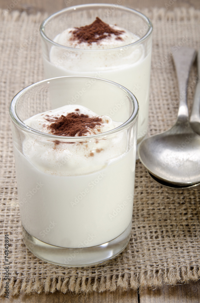 yogurt with cocoa powder in a glass yogurt with cocoa powder in a glass