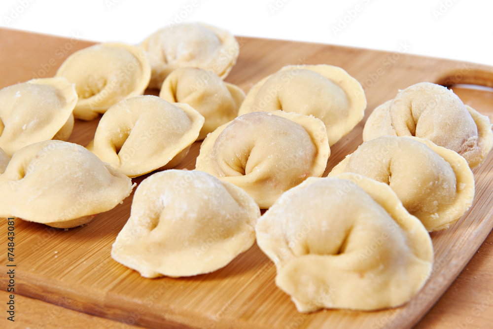 Dumplings on cutting board in kitchen Dumplings on cutting board in kitchen