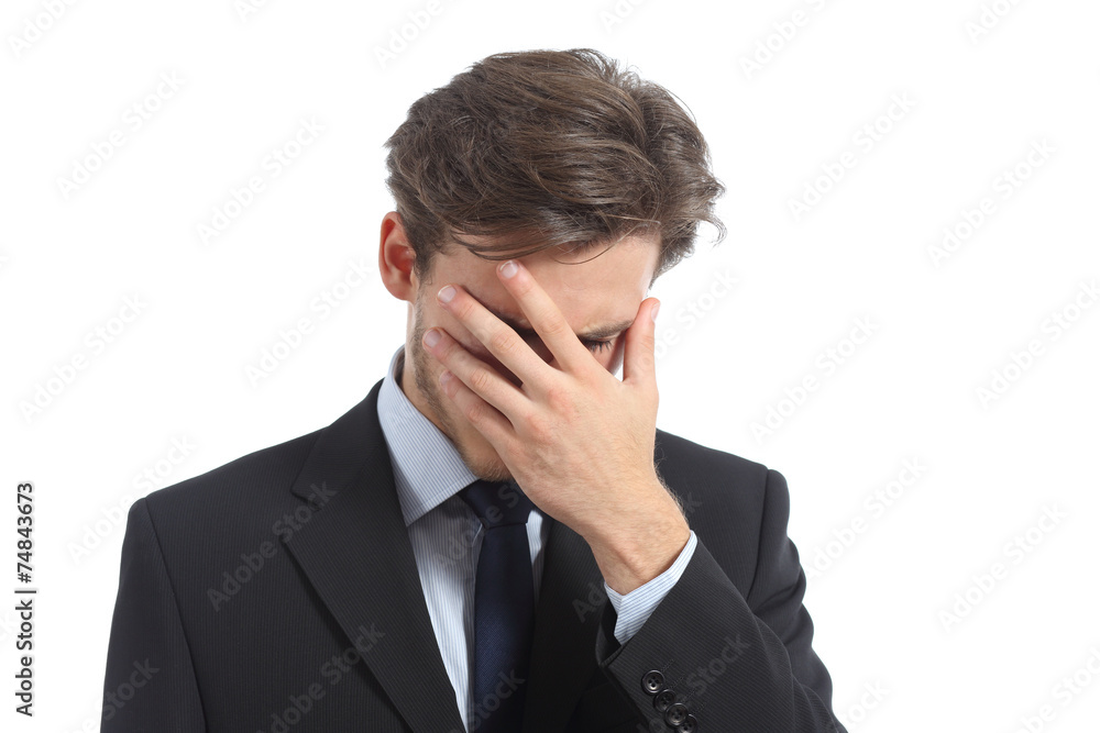 Worried or ashamed man covering his face with hand Worried or ashamed man covering his face with hand