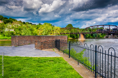 Storm clouds over the Delaware River and a train bridge in Easto photo