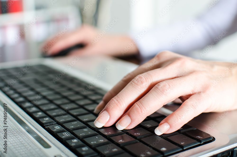 Businesswoman typing on a laptop Businesswoman typing on a laptop