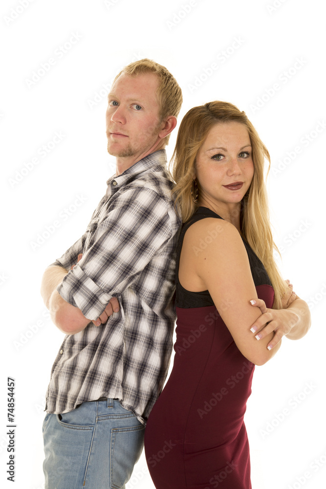 man and woman back to back arms folded looking man and woman back to back arms folded looking