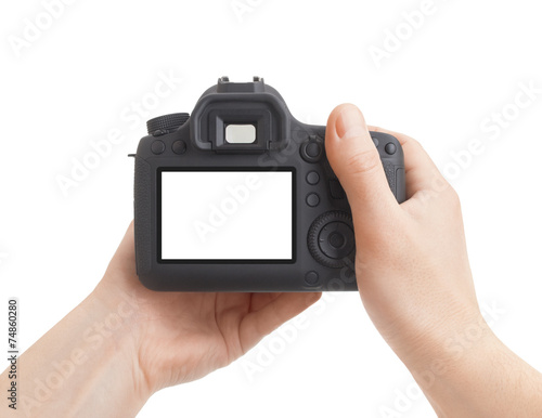 Camera in hand on white background