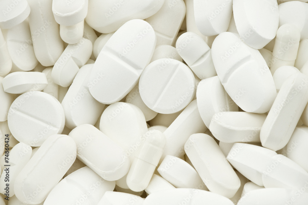 many white drugs pills shapes texture background many white drugs pills shapes texture background