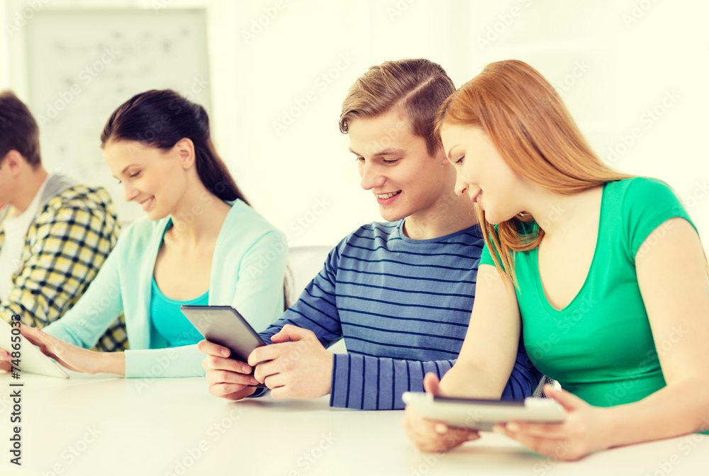 smiling students with tablet pc at school smiling students with tablet pc at school