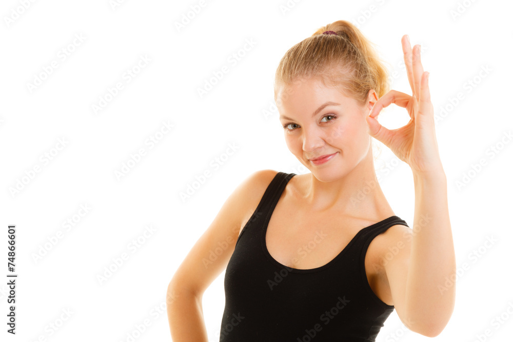 Fitness sporty girl showing ok okay hand sign gesture Fitness sporty girl showing ok okay hand sign gesture