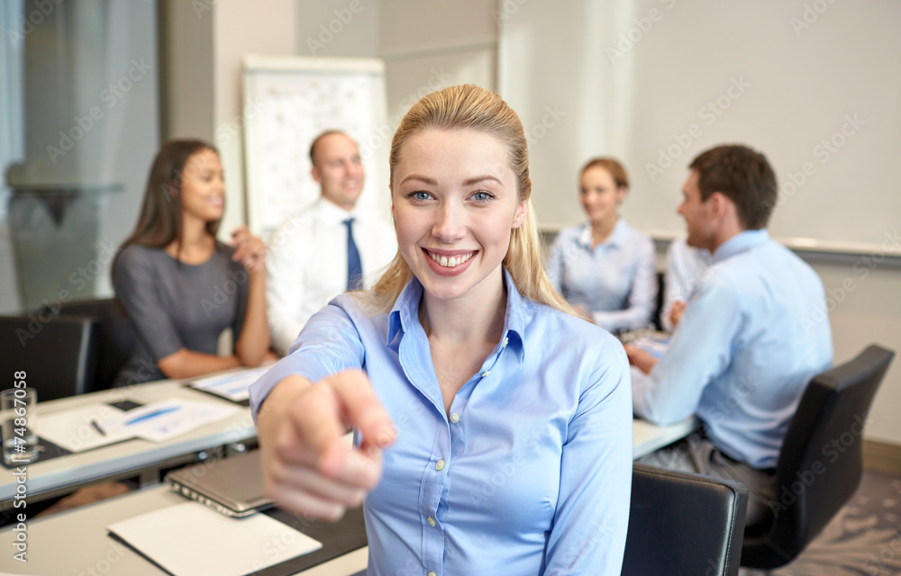 group of smiling businesspeople meeting in office group of smiling businesspeople meeting in office
