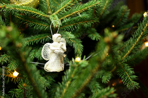 Christmas angel on christmas tree branch