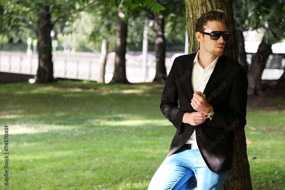 Fashion model wearing a blazer and jeans Fashion model wearing a blazer and jeans