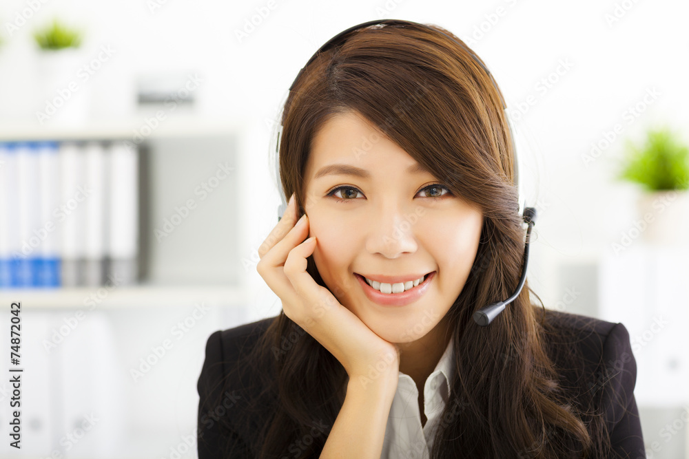 young beautiful business woman in headset young beautiful business woman in headset