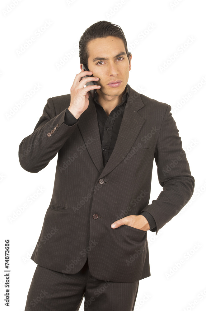 handsome young man wearing a suit posing using cell phone mobile handsome young man wearing a suit posing using cell phone mobile