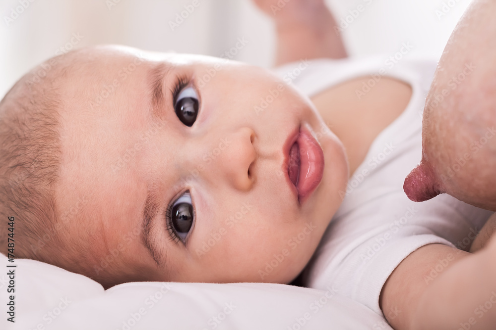 Beautiful innocence hungry baby sucking close up Beautiful innocence hungry baby sucking close up