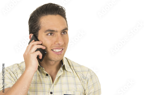 young handsome hispanic man posing using cell phone