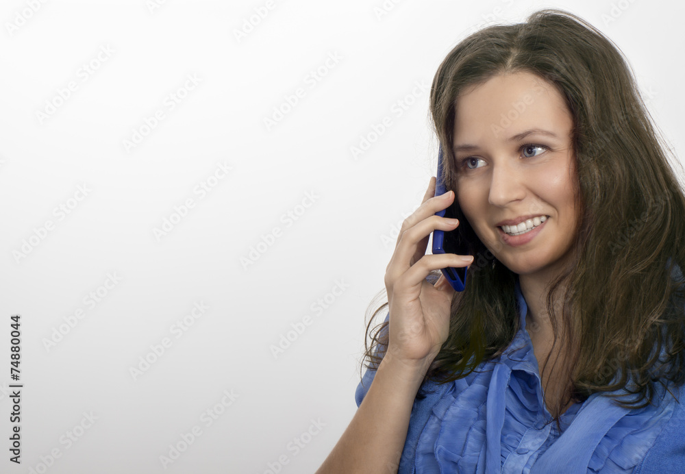 Woman in blue with a blue mobile Woman in blue with a blue mobile