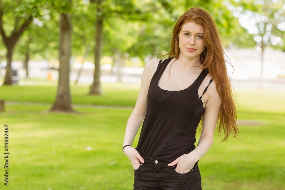 Beautiful young woman standing in park Beautiful young woman standing in park