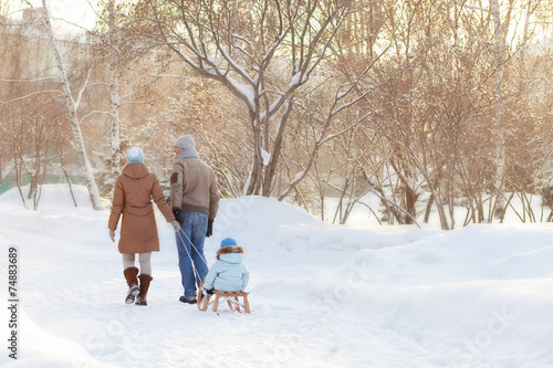 Young parents walking in Winter