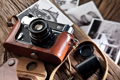Old rangefinder camera and black-and-white photos.