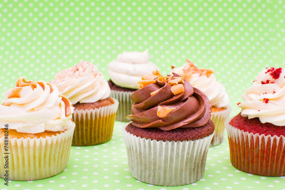 Some cupcakes on green background