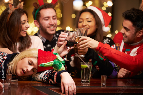 Woman Passed Out On Bar During Christmas Drinks With Friends